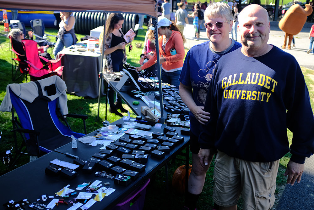 Karen and Mike Brooks, of Aurora Knight Accessories, stand beside a variety of jewelry they brought to the festival.